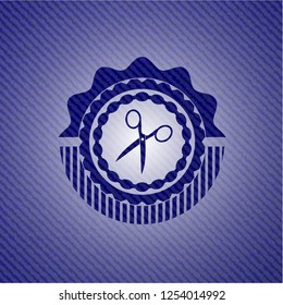 scissors icon inside denim background