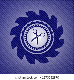 scissors icon inside emblem with jean texture