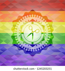 scissors icon inside emblem on mosaic background with the colors of the LGBT flag