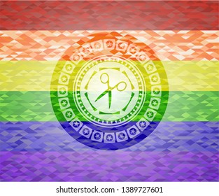 scissors icon inside emblem on mosaic background with the colors of the LGBT flag