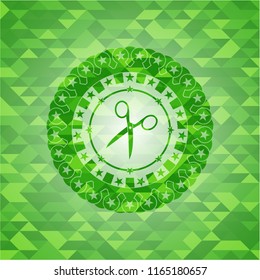 scissors icon inside green emblem with mosaic background