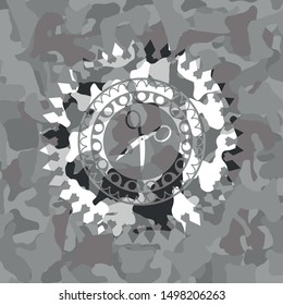 scissors icon inside grey camouflage texture