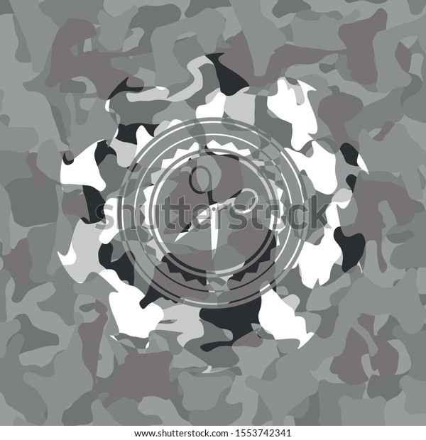 scissors icon inside\
grey camouflage\
emblem