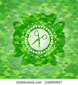 scissors icon inside realistic green mosaic emblem