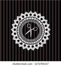 scissors icon inside silvery badge