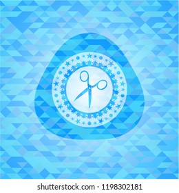 scissors icon inside sky blue mosaic emblem