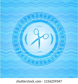 scissors icon inside water badge background.