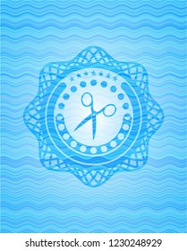 scissors icon inside water badge background.