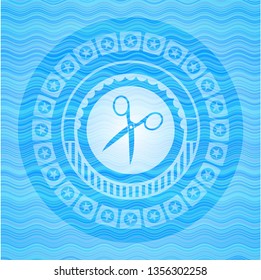 scissors icon inside water concept style badge.