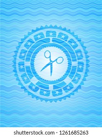 scissors icon inside water wave representation emblem background.