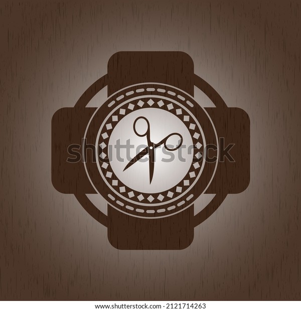 scissors icon inside\
wood badge or emblem.\
