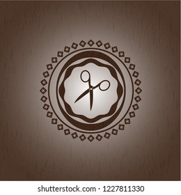 scissors icon inside wooden emblem. Vintage.