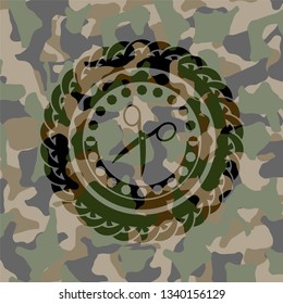 scissors icon on camo texture