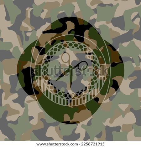 scissors icon on camo texture. 