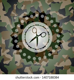 scissors icon on camouflage texture