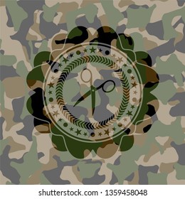 scissors icon on camouflaged pattern