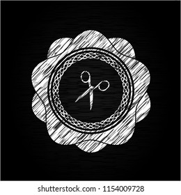scissors icon on chalkboard