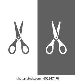 Scissors icon on dark and white background