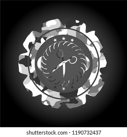 scissors icon on grey camo pattern
