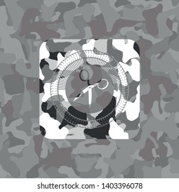 scissors icon on grey camo texture