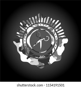 scissors icon on grey camouflaged texture