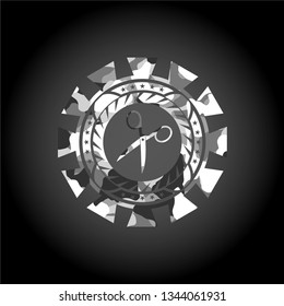 scissors icon on grey camouflaged pattern