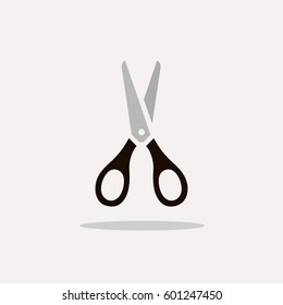 Scissors icon with shadow on a beige background
