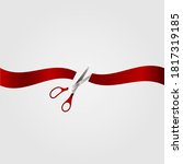 Scissors and red ribbon on a white background.
