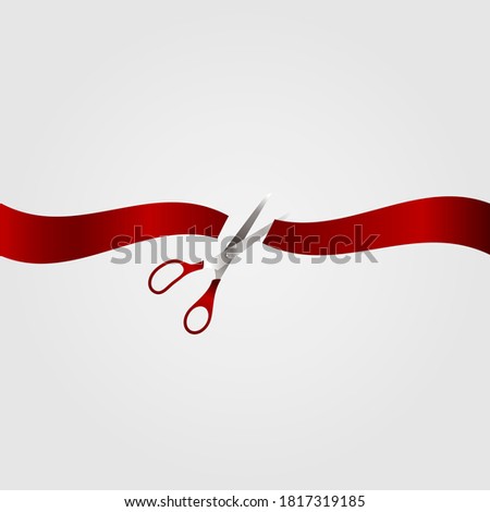 Scissors and red ribbon on a white background.
