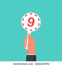 Score Card 9. Number Table. Digit Rating On A Scorecard. Human Hand Holding Score Card. Colored Scorecards. Juries Assessment On Competition. Judges Hold Score. Vector Design. Isolated On Background.