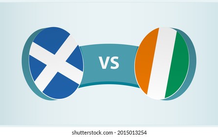 Scotland versus Ivory Coast, team sports competition concept. Round flag of countries.