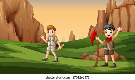 Scout boy in uniform exploring the nature