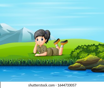 A scout girl lay down on the grass