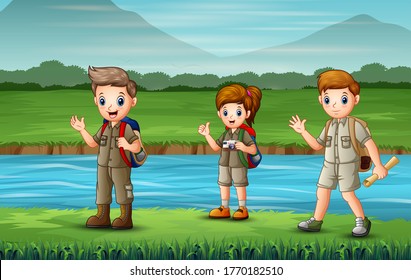The scouts walking along the river
