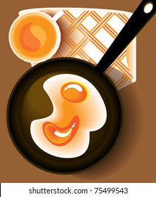 Scrambled eggs - fried in a pan and a cup of juice