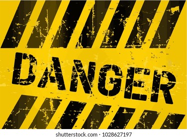 Scratched dark inscription "Danger" on yellow background