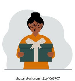 Screaming woman holds a large gift box with a bow in his hands. Vector