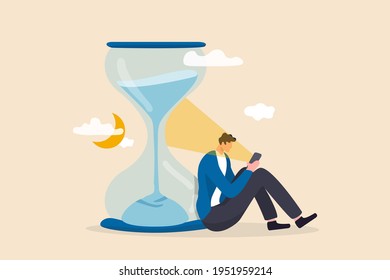 Screen time, doom scrolling or wasted time using smartphone, staying late night with mobile addiction concept, exhausted man sitting with sandglass using smartphone with bright light on his face.