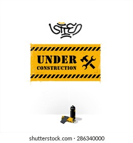 Screensaver - the stencil on the wall "site under construction". In the style of graffiti, are at the bottom of aerosol cans with paint and lay spotted gloves.
