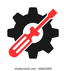 screw driver in front of a gear isolated in white background