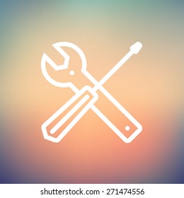 Screw driver and wrench tools icon thin line for web and mobile, modern minimalistic flat design. Vector white icon on gradient mesh background.