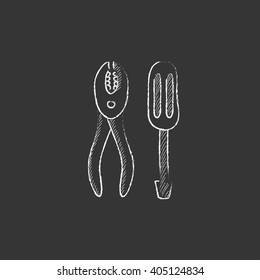 Screwdriver with pliers. Drawn in chalk icon.