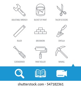 Screwdriver, scissors and adjustable wrench icons. Spatula, mining tool and paint roller linear signs. Brickwork, ruler and painting icons. Video cam, book and magnifier search icons. Vector