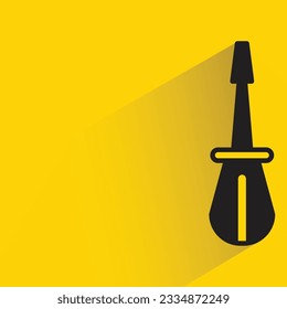 screwdriver with shadow on yellow background