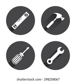Screwdriver and wrench key tool icons. Bubble level and hammer sign symbols. Circles buttons with long flat shadow. Vector