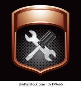 screwdriver and wrench on bronze display