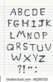 Scribble alphabet on a notebook paper