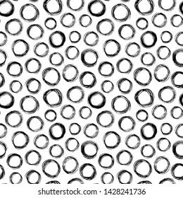 Scribble circles hand drawn seamless vector pattern. Chaotic rings ink dirty texture. Black paint brush splodges background. Abstract rough circular backdrop. Wallpaper, textile design.