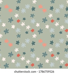 Scribble flower figures random seamless pattern. Blue, white and pink colored shapes on grey background. Great for wrapping paper, textile, fabric print and wallpaper. Vector illustration.