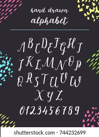 Script font alphabet written with a brush. Vector alphabet. Hand drawn letters and numbers.